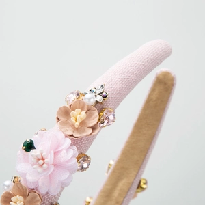 Retro style headband with pink mesh flowers, rhinestones and metal butterfly ornament
