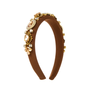 Detailed view of Baroque headband with amber crystals and gold flower settings