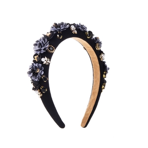 Detail view of vintage baroque headband with mesh flowers, pearls and black rhinestones