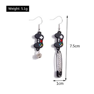 Detail view of asymmetric game controller earring and safety pin tassel with measurements