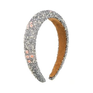 Detail of sponge headband with silver rhinestones, white pearls and small floral charms