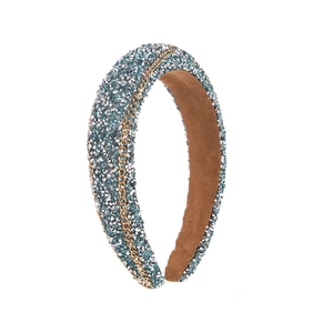 Detailed view of Baroque headband featuring blue rhinestones and gold chain links