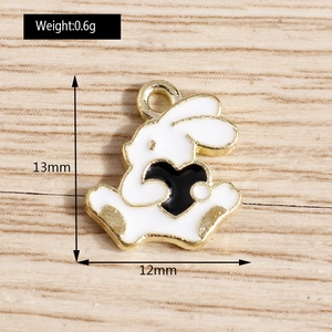 Macro view of white enamel rabbit pendant with size dimensions 13mm by 12mm