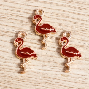 Three red enamel flamingo charms in gold alloy metal for DIY jewelry making and crafts