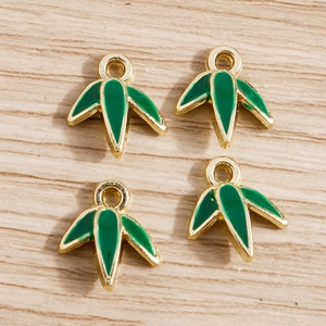 Bamboo leaf pendants set in gold metal with dark green enamel for DIY jewelry making