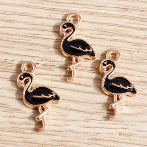 Three gold-plated flamingo alloy charms with black enamel finish for DIY jewelry crafting