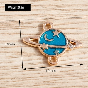 Detail view of blue planet charm with gold moon and star patterns and dimensions
