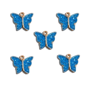 Set of five blue butterfly pendants with gold metal frames and sparkling glitter