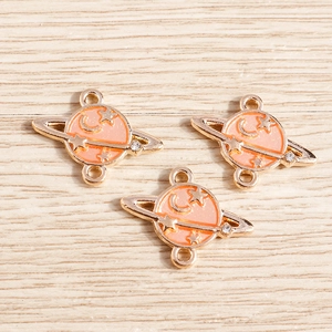 Pink enamel planet charms with star and moon details for DIY jewelry making sets