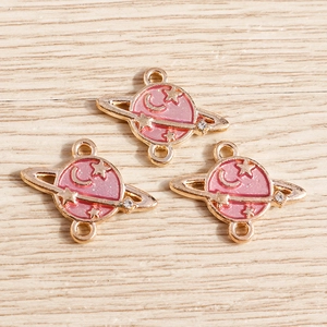 Pink enamel planet charms with moon and star details for DIY jewelry making