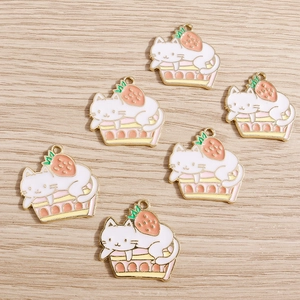 Cute white cat on pink strawberry cake charms made of gold plated alloy with enamel detail