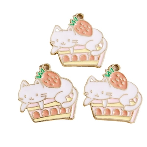 Enamel alloy charms featuring a cute white cat on a cake with a red strawberry detail