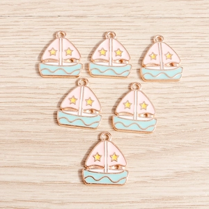 Cartoon enamel sailboat charms in pink and blue for DIY jewelry making and crafts