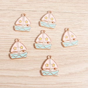Cartoon sailboat enamel charms with pink sails and blue hulls for DIY jewelry making