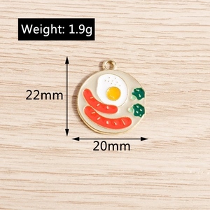Detail of breakfast charm showing dimensions 20mm by 22mm with egg and sausage enamel
