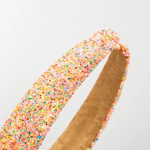Sparkly multi-colored sequin headband with thick padded structure and soft brown lining