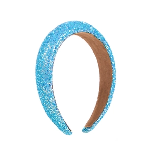 Detailed view of sky blue glitter headband with soft brown velvet non-slip inner lining