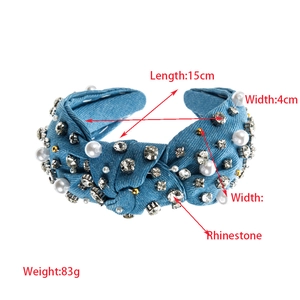Detail of blue denim headband with white pearls and sparkling rhinestones 15cm size