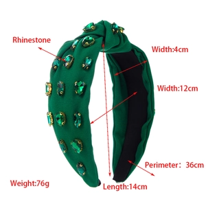 Detailed view of emerald rhinestone knotted headband with fabric width and size dimensions
