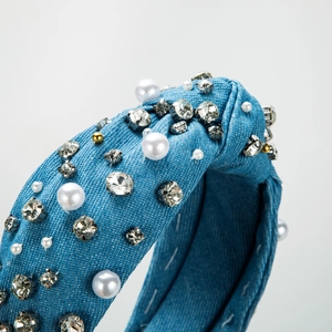 Knotted denim headband for women featuring white pearls and sparkling rhinestones