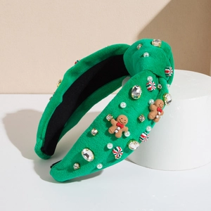 Cerchietto natalizio in velluto verde con omino di pan di zenzero, caramelle e strass
