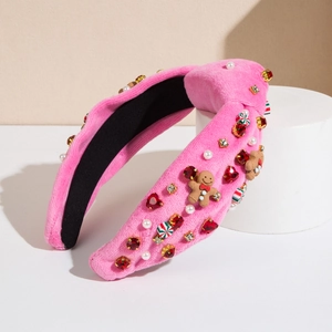 Cerchietto natalizio in velluto rosa con omino di pan di zenzero e strass colorati