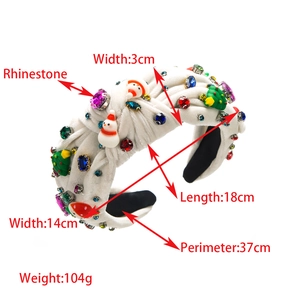 Detail view of knotted Christmas headband with velvet, colorful rhinestones and snowman icons
