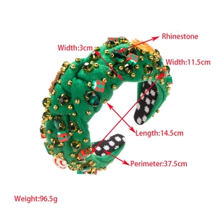 Detail view of green velvet Christmas headband with rhinestones and red gift box charms