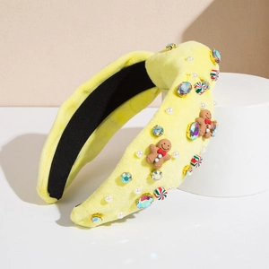 Cerchietto natalizio in velluto giallo con strass, omino di pan di zenzero e caramelle