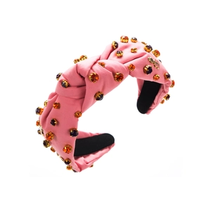 Pink knotted velvet headband with orange and purple gemstones in high-quality metal settings
