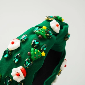 Christmas headband with Santa Claus, Xmas tree, and green gemstones on fabric