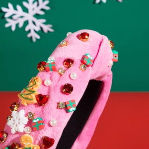 Pink velvet Christmas headband featuring gingerbread man, snowflakes and festive rhinestones