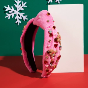Cerchietto natalizio in velluto rosa con omino di pan di zenzero e gemme preziose