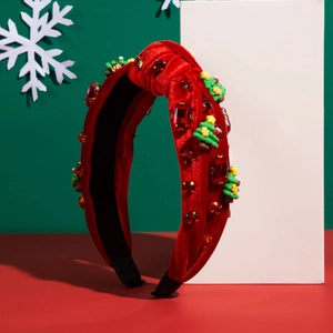 Serre-tête de Noël en velours rouge avec strass et ornements de sapin sur socle blanc