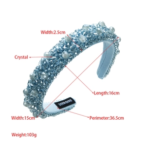 Detail view of handmade blue crystal beaded sponge headband with Hand Made label
