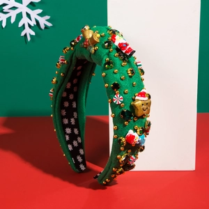 Detailed view of green padded Christmas headband with Santa, bells, and colorful resin icons