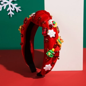 Detail view of festive red velvet headband with 3D snowflake and Christmas tree ornaments