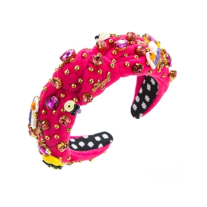 Detail of rose red velvet headband with Angel lettering and colorful crystals