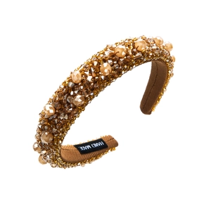 Detailed close-up of handmade wide crystal headband with amber beads and sequins