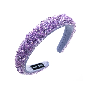 Close-up of handmade purple crystal beaded headband with luxury sponge padding