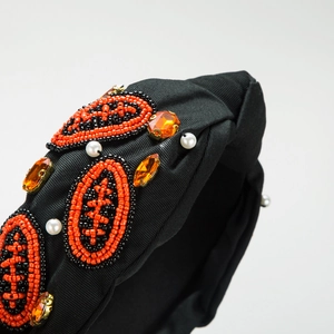 Serre-tête baroque noir à nœud avec broderie rugby et cristaux orange brillants
