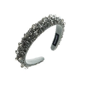 Close-up of handmade gray crystal beaded headband with a luxury sponge interior and woven label