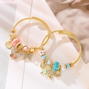 DIY gold beaded bracelets with butterfly charms and sparkling crystals for women