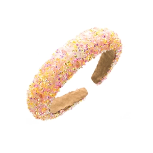 Close-up of pink and yellow sequined thick headband with soft brown suede inner lining