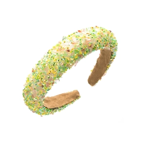 Detail of colorful resin crystal beads on a wide sponge headband with soft inner lining