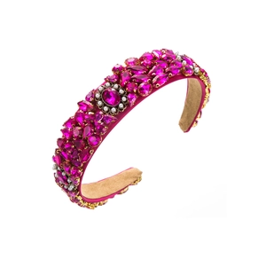 Detailed macro view of luxury baroque headband with rose red crystals and white pearls