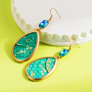 Bohemian teardrop earrings with green leather inlay and blue crystal in gold setting
