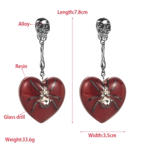 Gothic skull and red resin heart drop earrings with spider accent for party wear