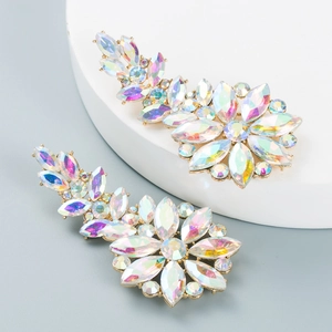 Macro detail of gold flower earrings with iridescent AB rhinestones and hollow design