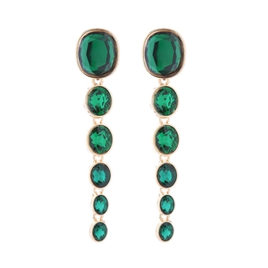 Detail view of multi-layered long emerald green crystal earrings with gold plating